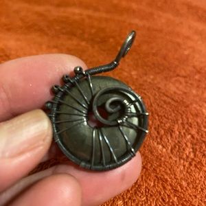 Intricate wire wrap stone pendant